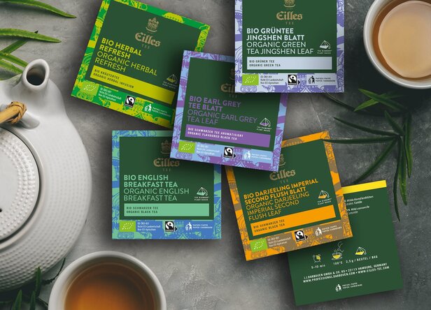 Eilles Bio-Teeauswahl mit Earl Grey, English Breakfast und mehr, präsentiert mit Teekanne und Tasse.
